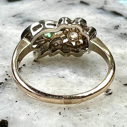Vintage gold round cut emerald and diamond ring.