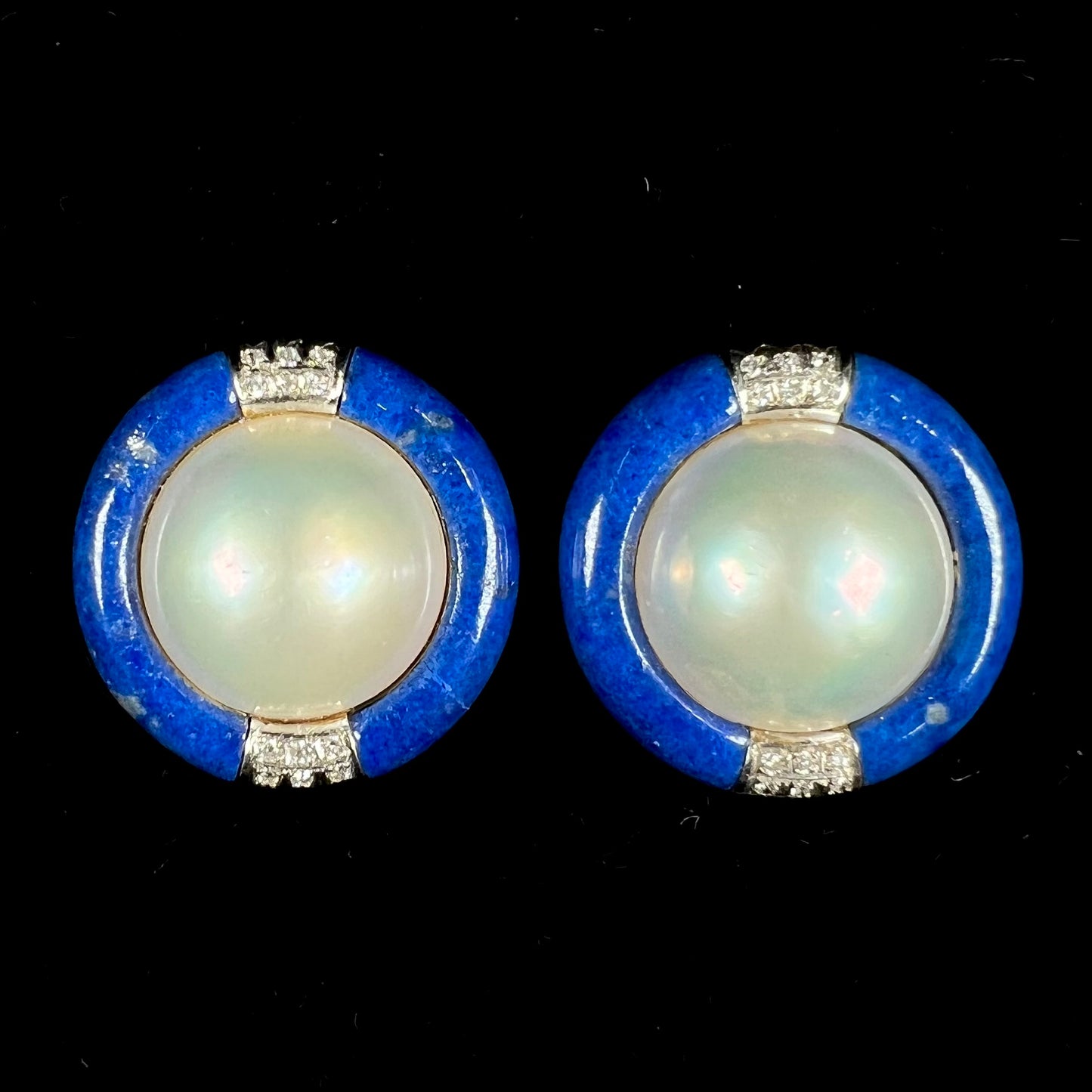 A pair of mabe pearl earrings set into lapis lazuli stone inlay with diamond accents.