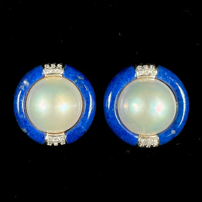 A pair of mabe pearl earrings set into lapis lazuli stone inlay with diamond accents.