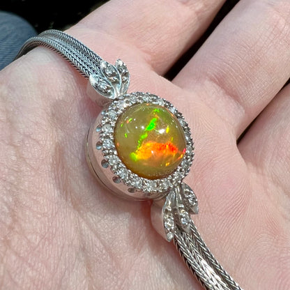 A Virgin Valley fire opal and diamond bracelet made from a vintage 1930's watch.
