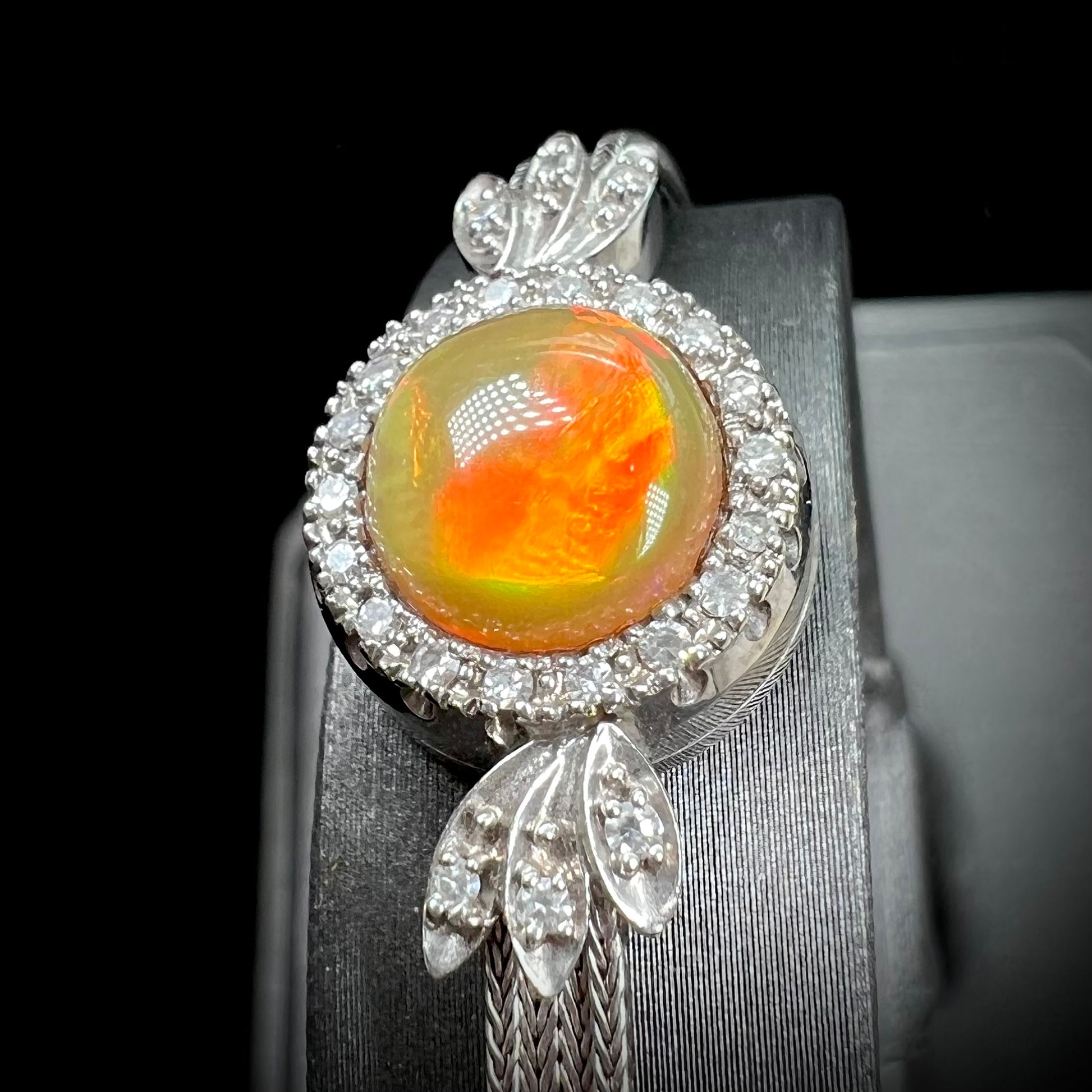 A Virgin Valley fire opal and diamond bracelet made from a vintage 1930's watch.