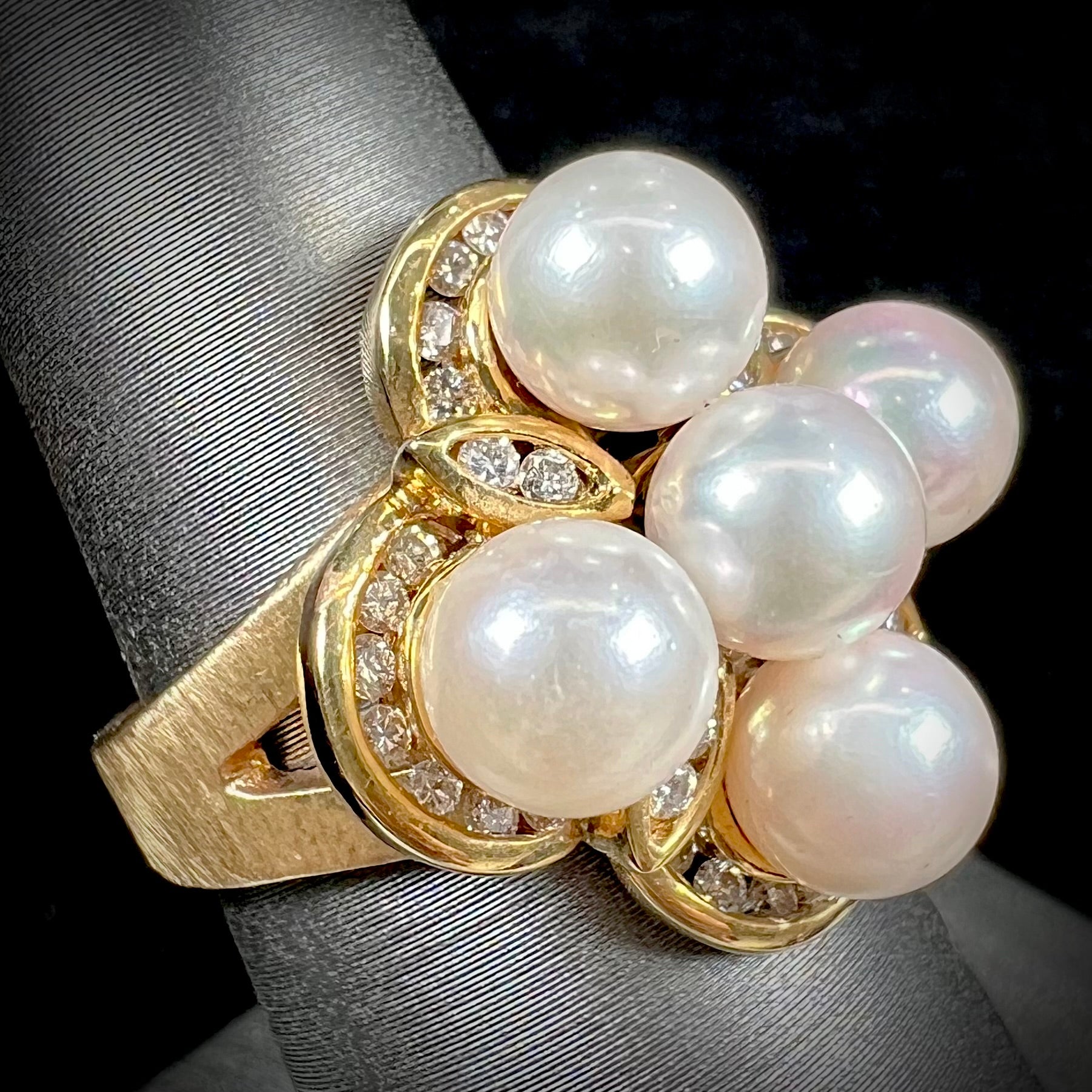 A ladies' vintage 1960's pink Akoya pearl and diamond quatrefoil ring.  The shank of the ring is textured.