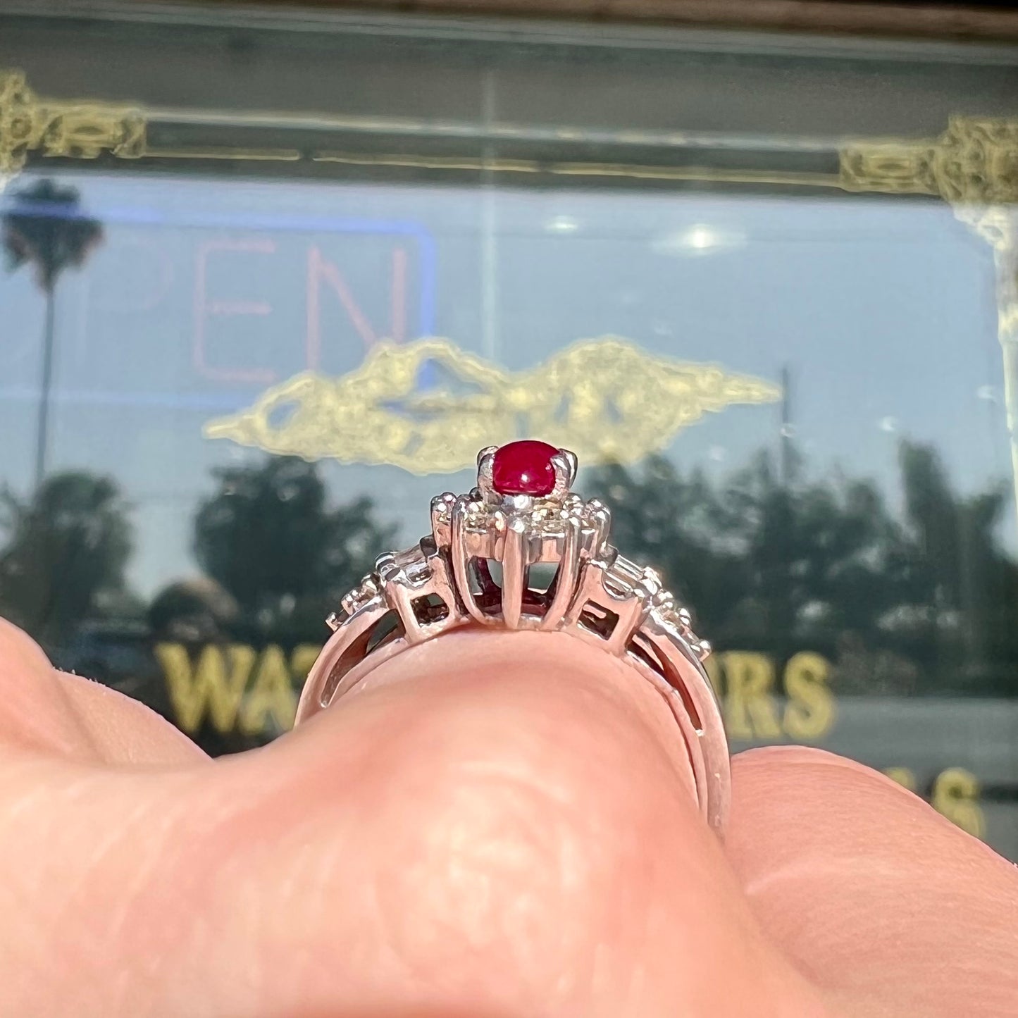 A vintage style white gold marquise cabochon cut ruby and diamond ring.