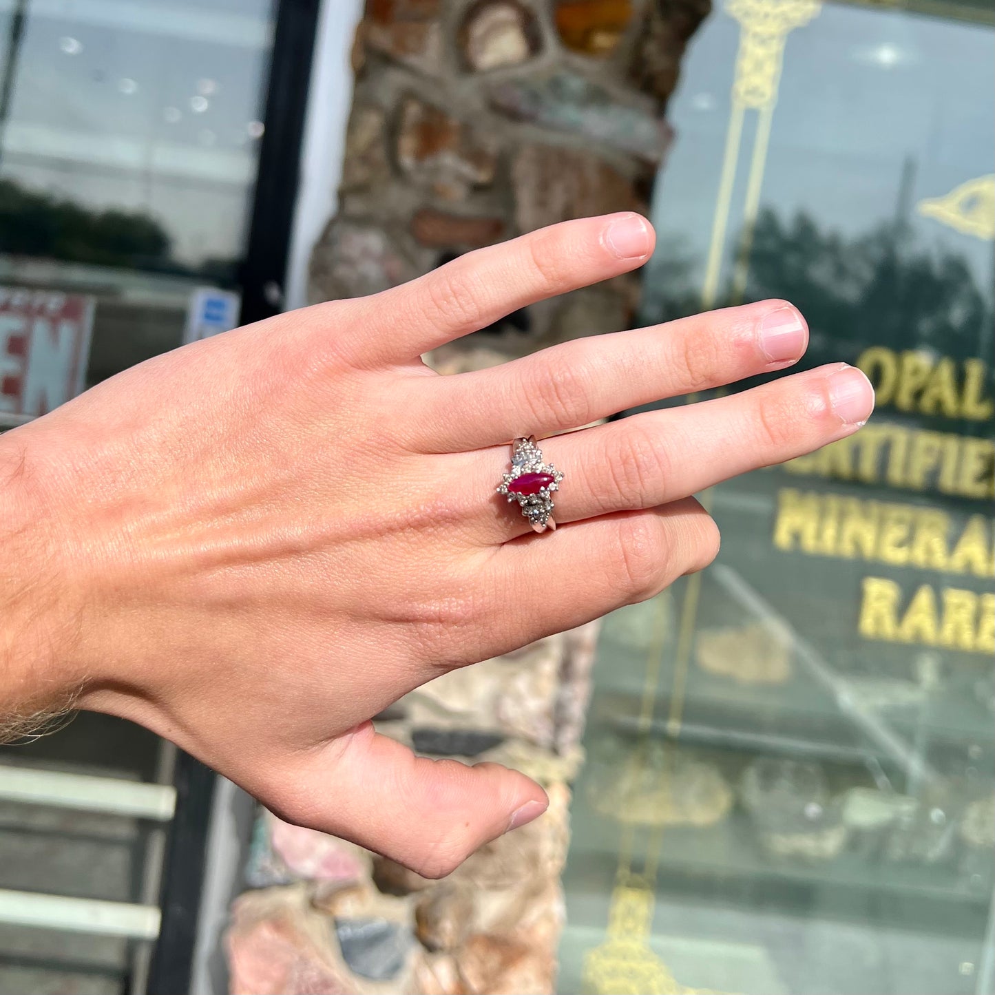 A vintage style white gold marquise cabochon cut ruby and diamond ring.