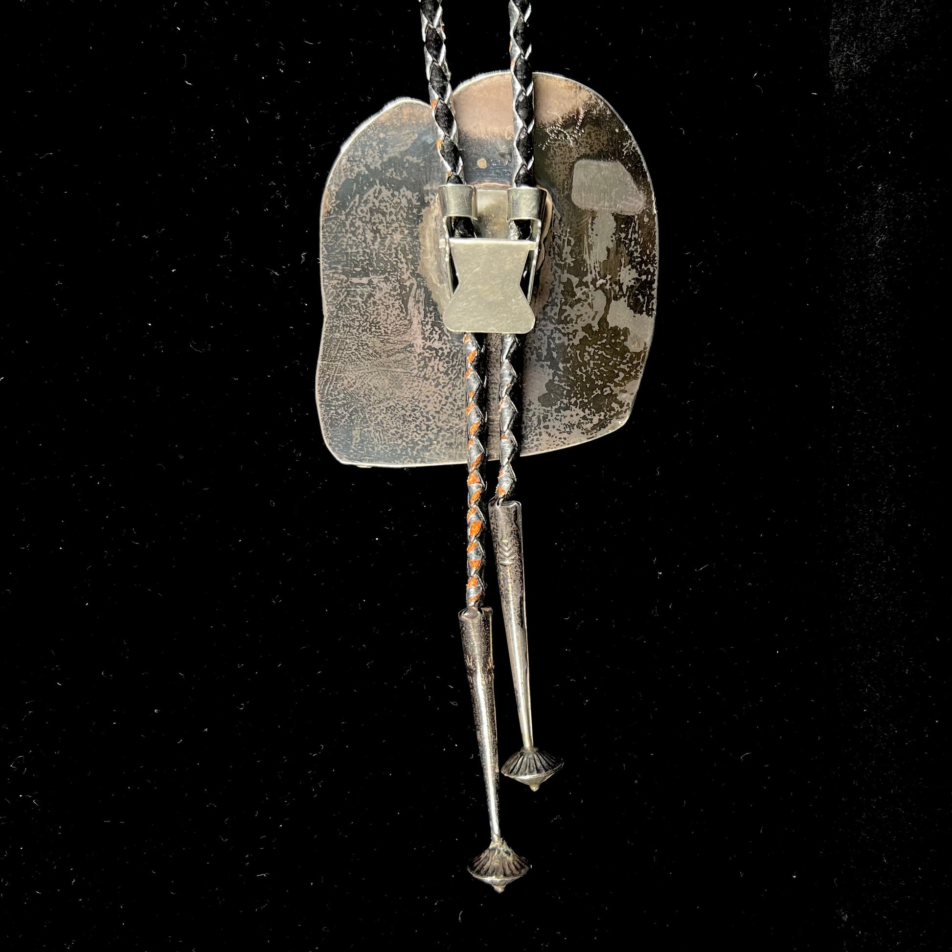 A men's sterling silver bolo tie set with a Biggs picture jasper stone.