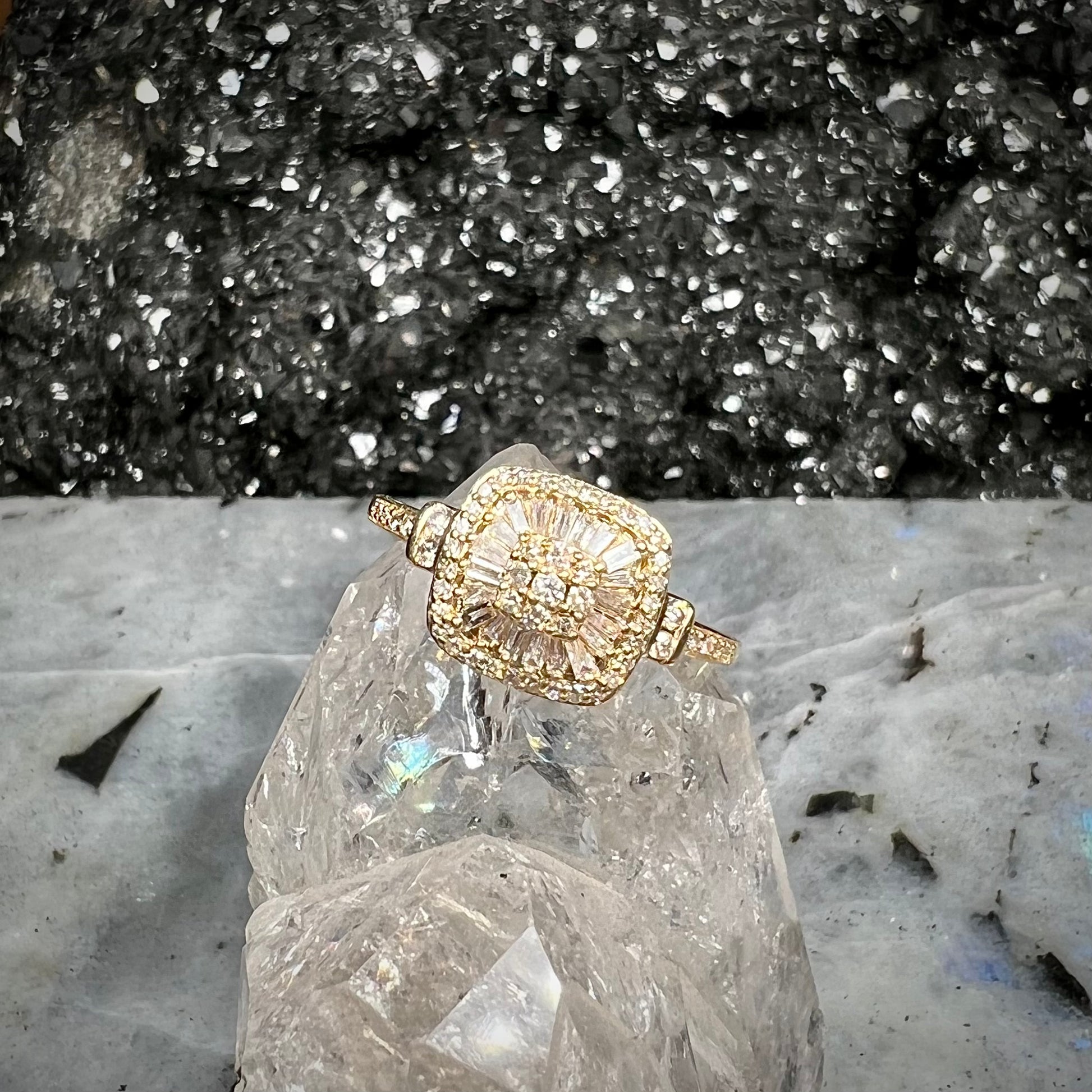 A 1930's style yellow gold diamond cluster ring set with round and baguette cut diamonds.