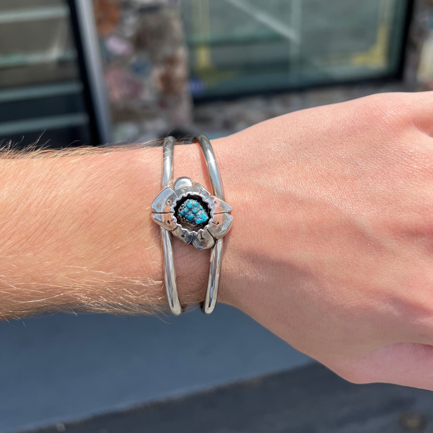 A Navajo style rough turquoise nugget silver cuff bracelet.