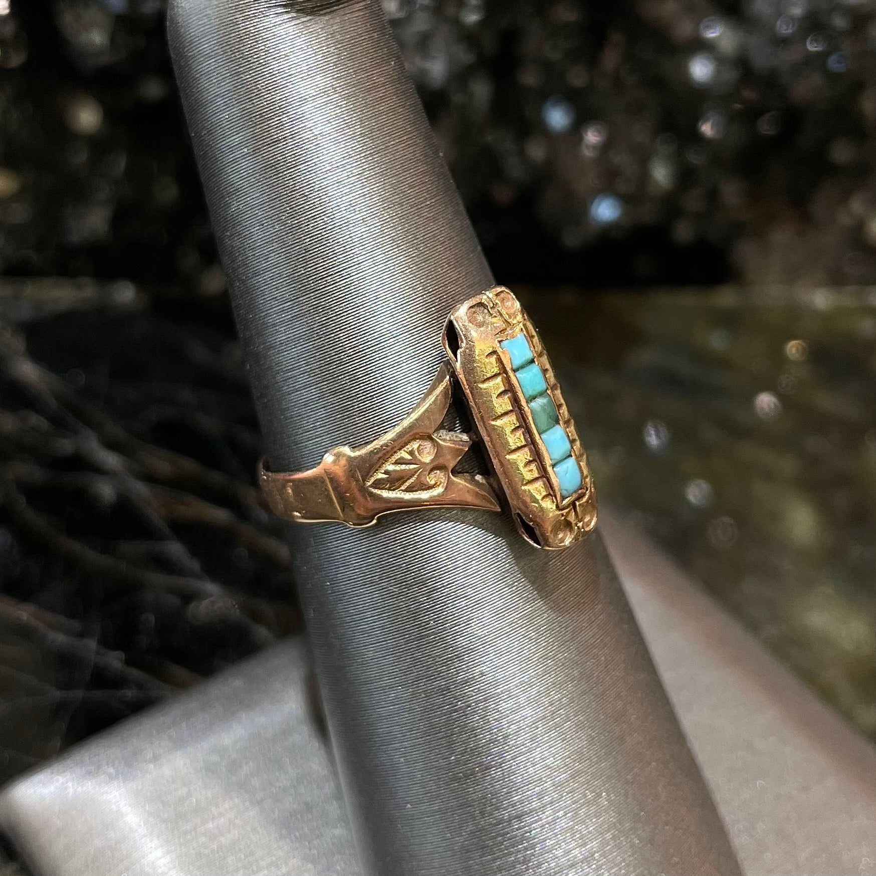 Antique yellow gold ring set with five square turquoise stones, circa 1920's.