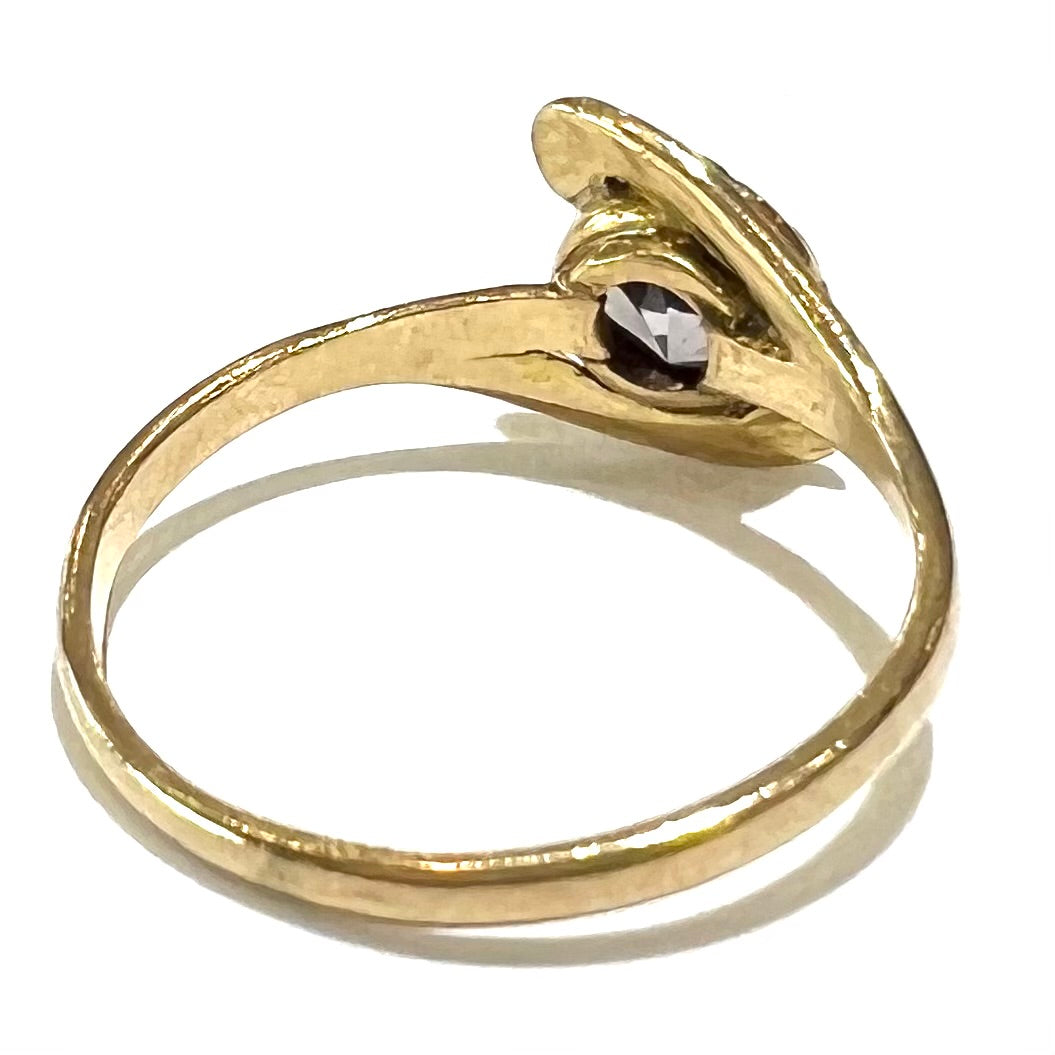 A vintage 1960's yellow gold ring set with a round synthetic purple alexandrite.  The prongs are worn.