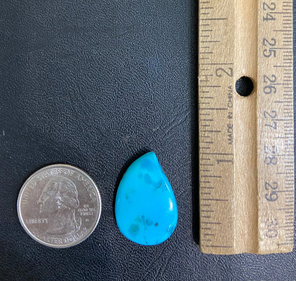 A loose, water drop shaped turquoise stone from the Sleeping Beauty Mine, Arizona.