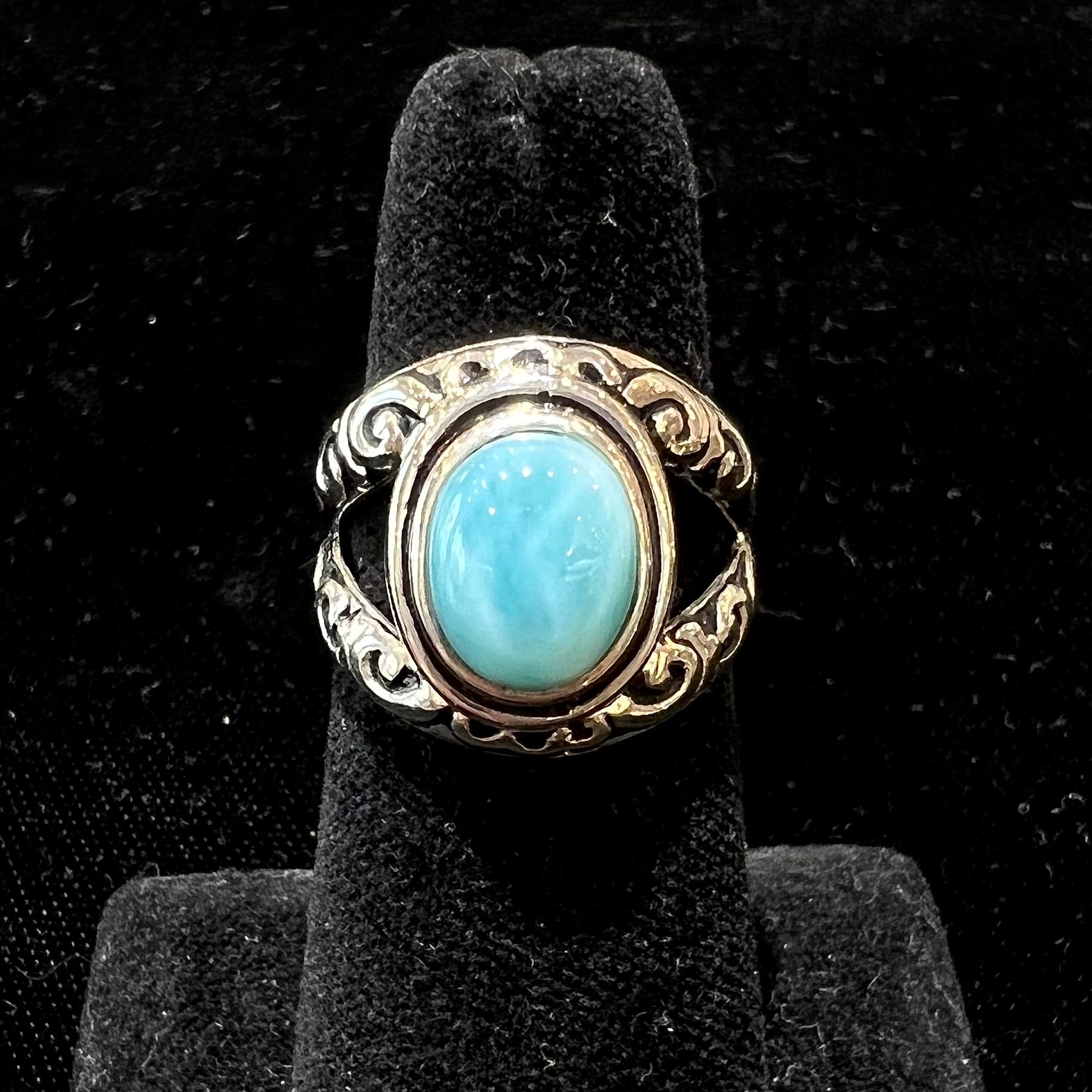 Sterling silver ring with black antiqued highlights set with blue larimar stone.