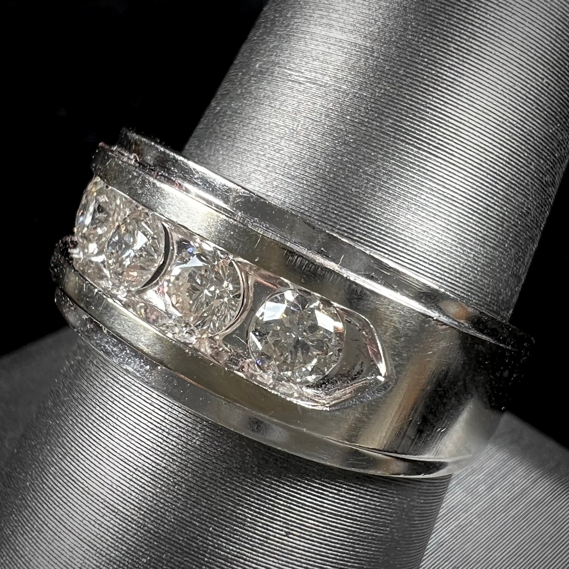A men's estate white gold five stone diamond ring.