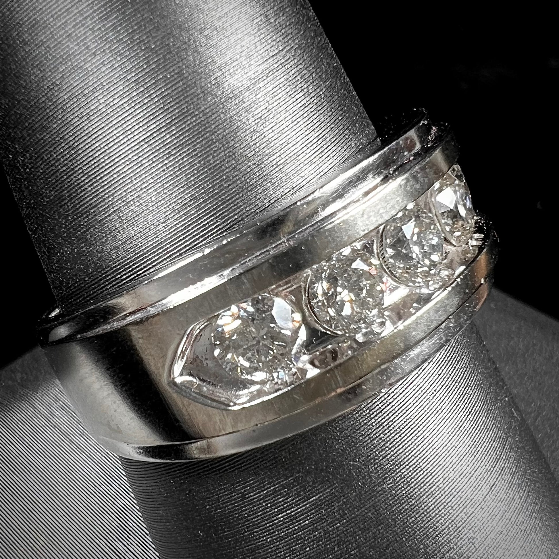 A men's estate white gold five stone diamond ring.