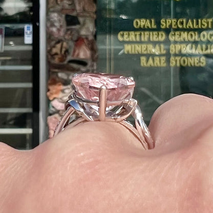A white gold and diamond heart shaped morganite engagement ring.