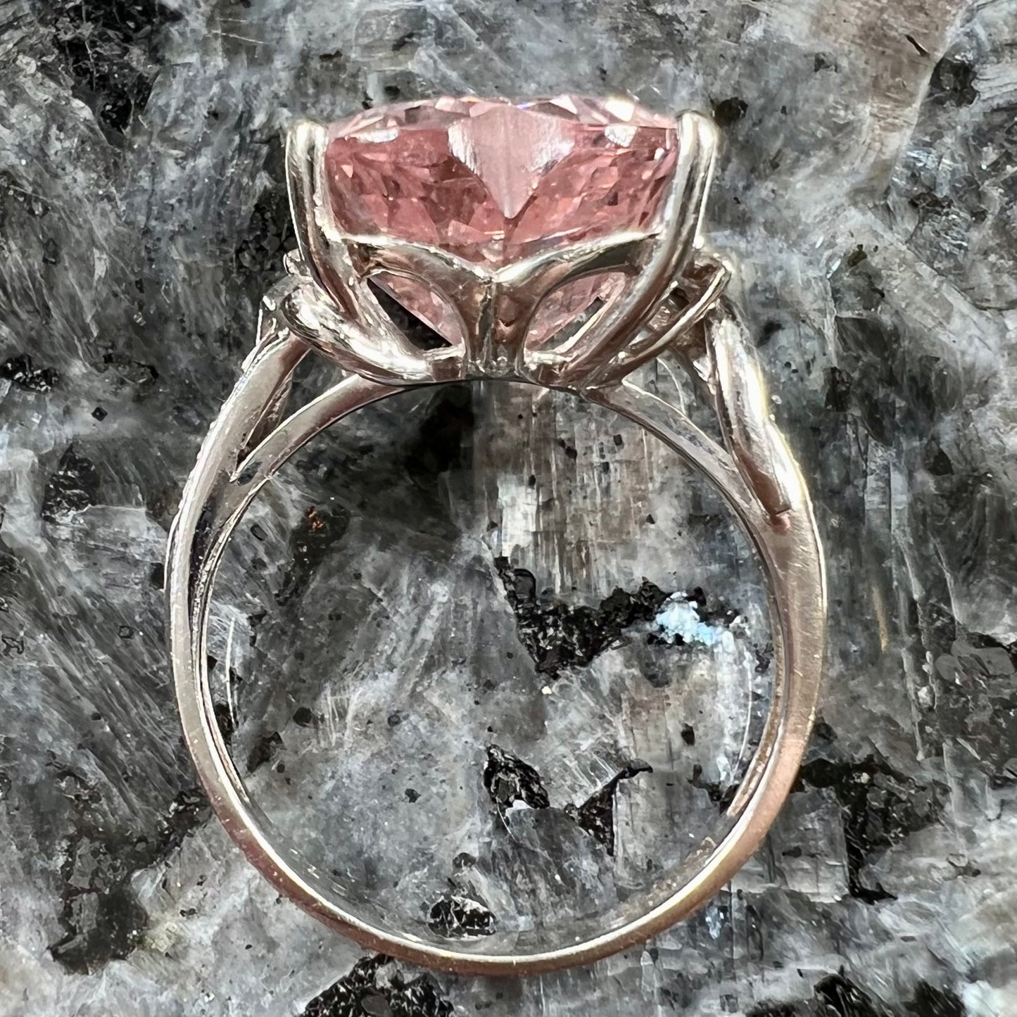A white gold and diamond heart shaped morganite engagement ring.