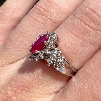 A vintage style white gold marquise cabochon cut ruby and diamond ring.