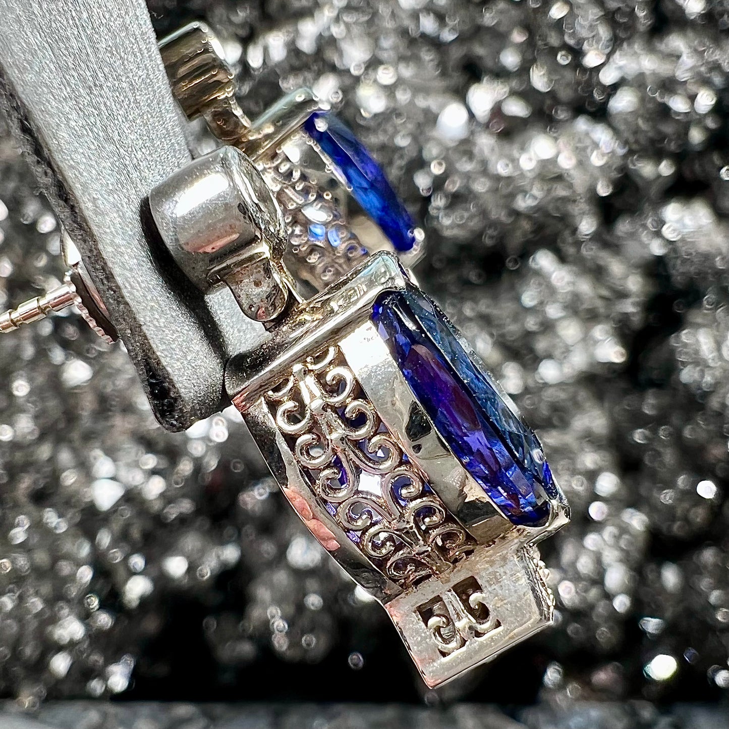 A pair of white gold, AAA grade tanzanite & diamond dangle earrings.