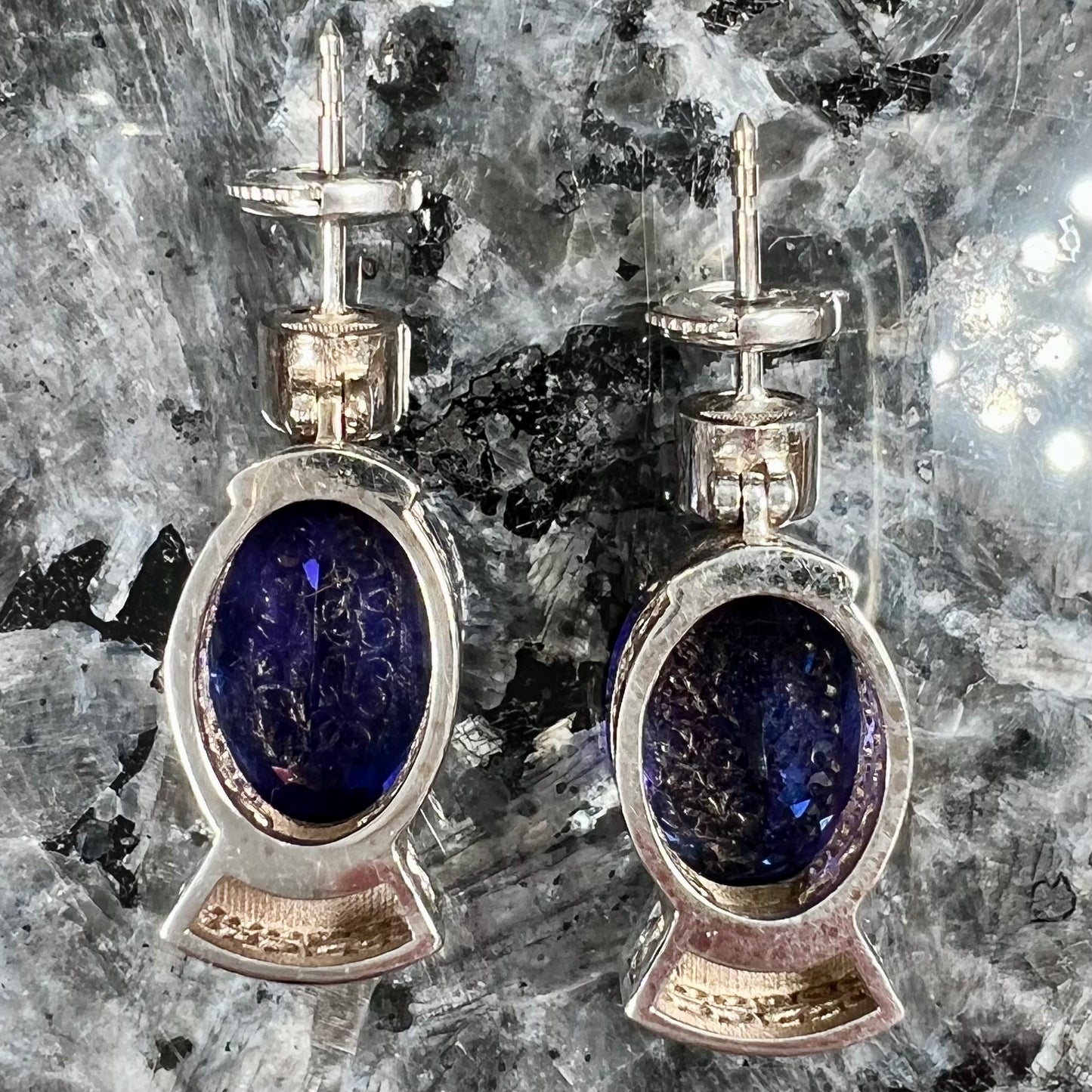 A pair of white gold, AAA grade tanzanite & diamond dangle earrings.