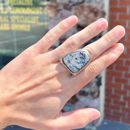 A bezel set ring handmade in sterling silver with a white dendritic agate stone.