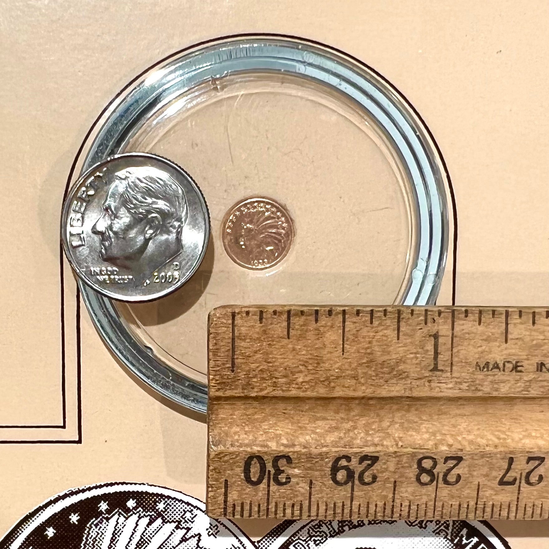 A 14 karat gold miniature commemorative of a 1933 Indian Head Gold Eagle coin.