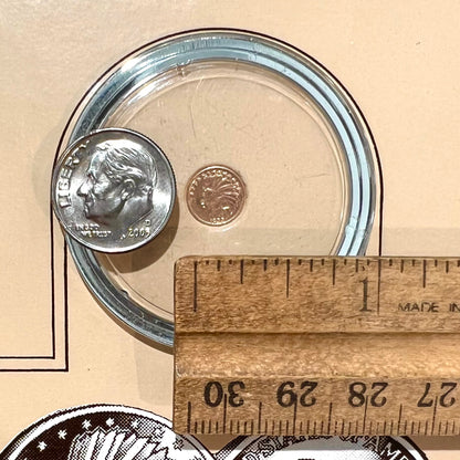 A 14 karat gold miniature commemorative of a 1933 Indian Head Gold Eagle coin.