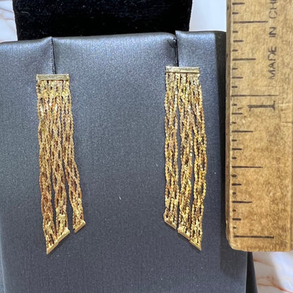 A pair of yellow gold waterfall dangle earrings.
