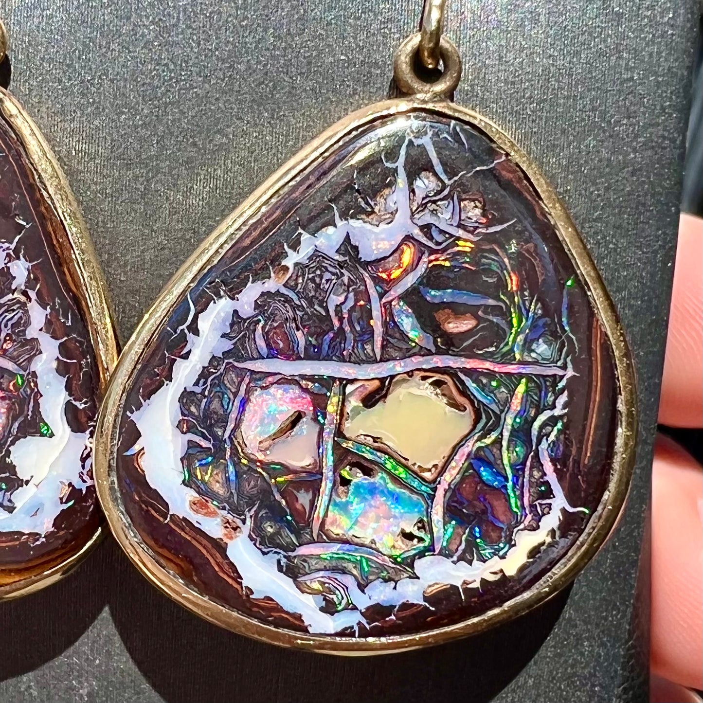 A pair of yellow gold bezel set Yowah nut boulder opal dangle earrings.