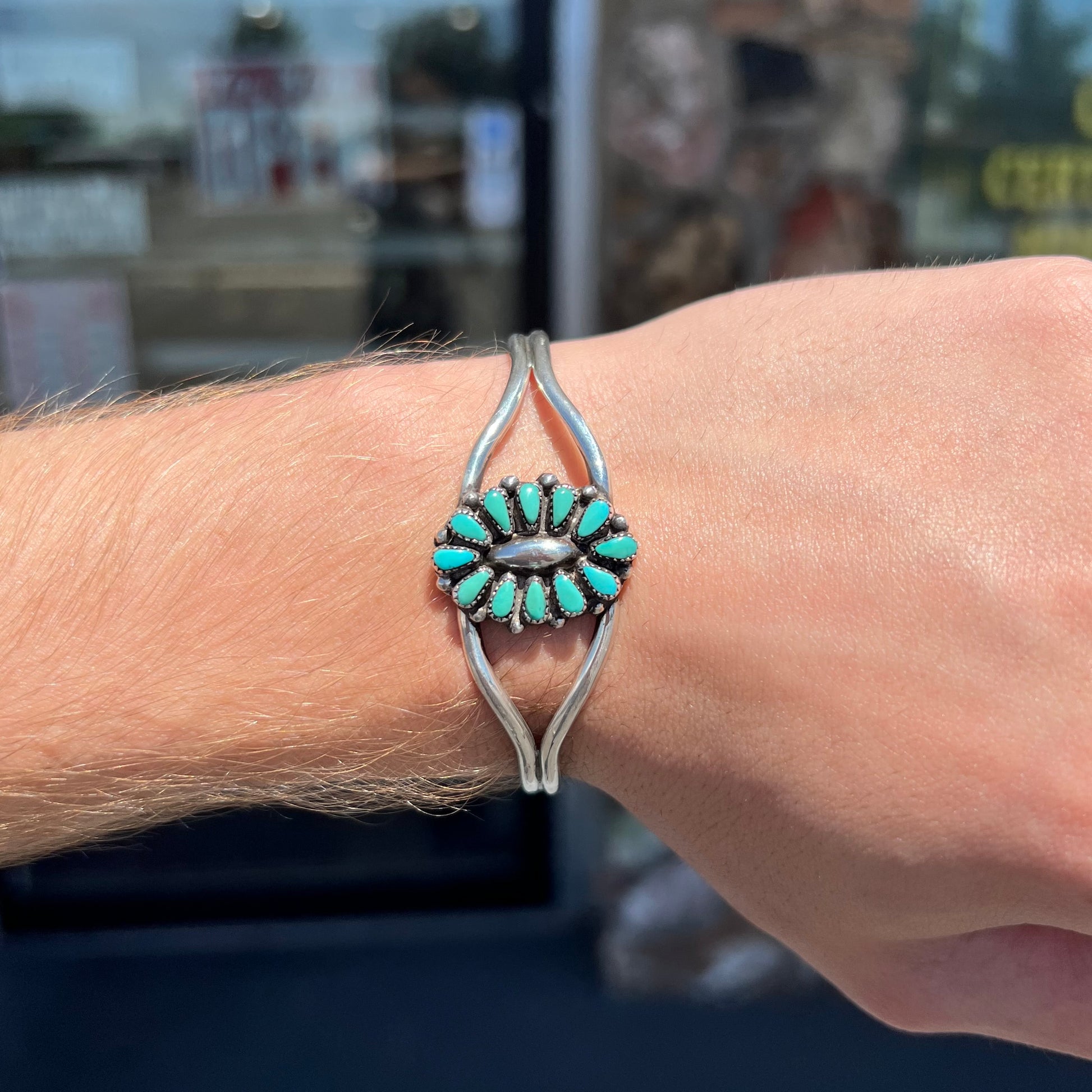 A Zuni style petit point silver turquoise cuff bracelet.  The piece was handmade and signed by Maryann and Felix Chavez.