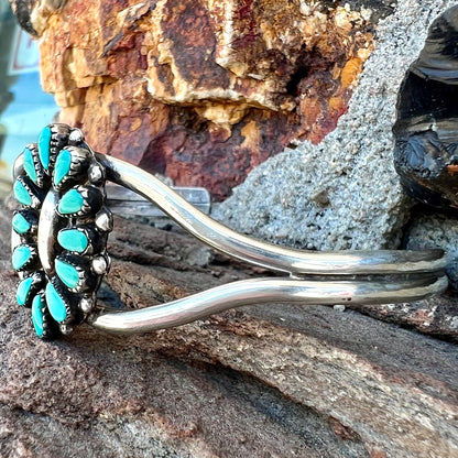 A Zuni style petit point silver turquoise cuff bracelet.  The piece was handmade and signed by Maryann and Felix Chavez.