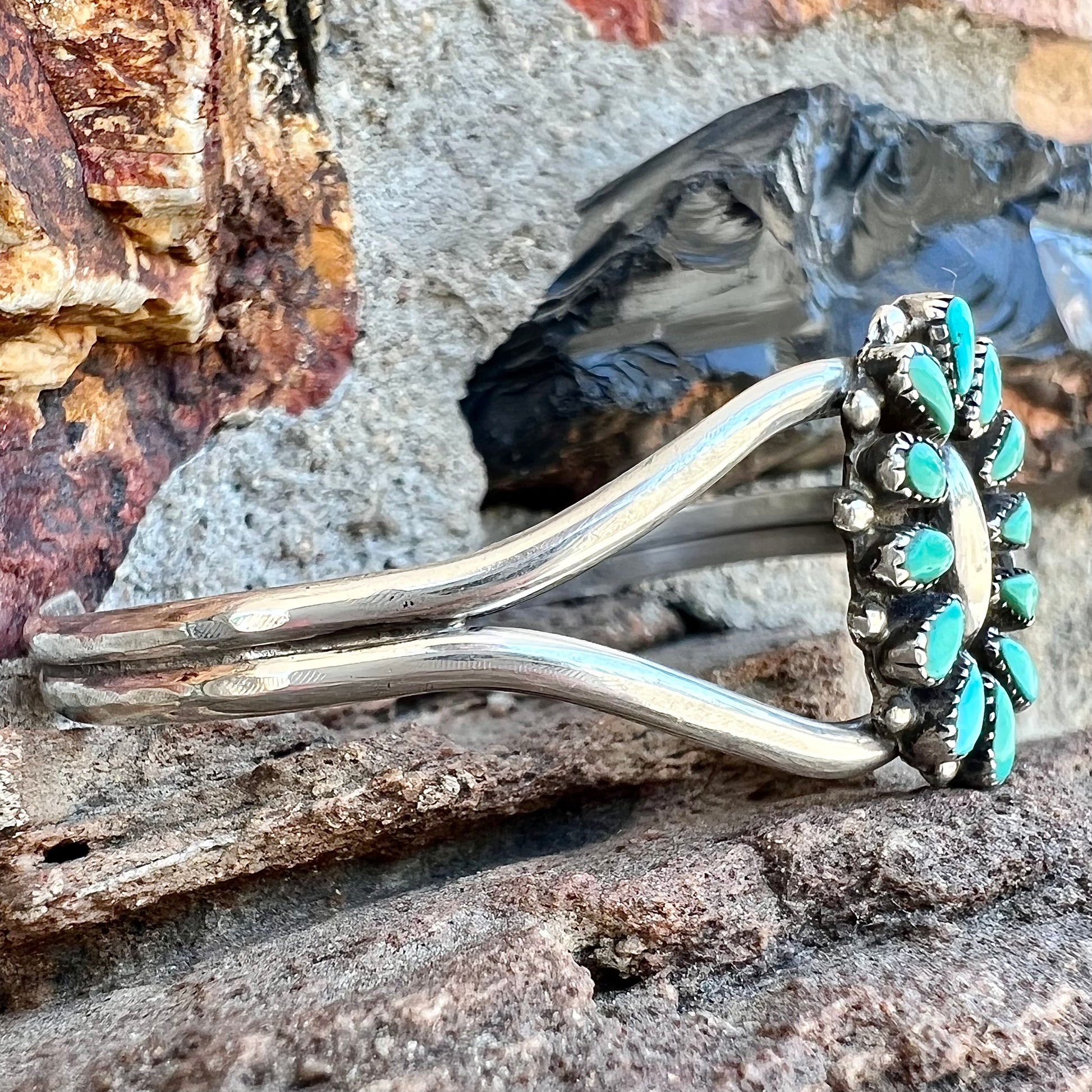 A Zuni style petit point silver turquoise cuff bracelet.  The piece was handmade and signed by Maryann and Felix Chavez.