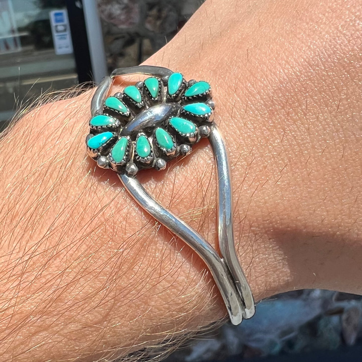 A Zuni style petit point silver turquoise cuff bracelet.  The piece was handmade and signed by Maryann and Felix Chavez.